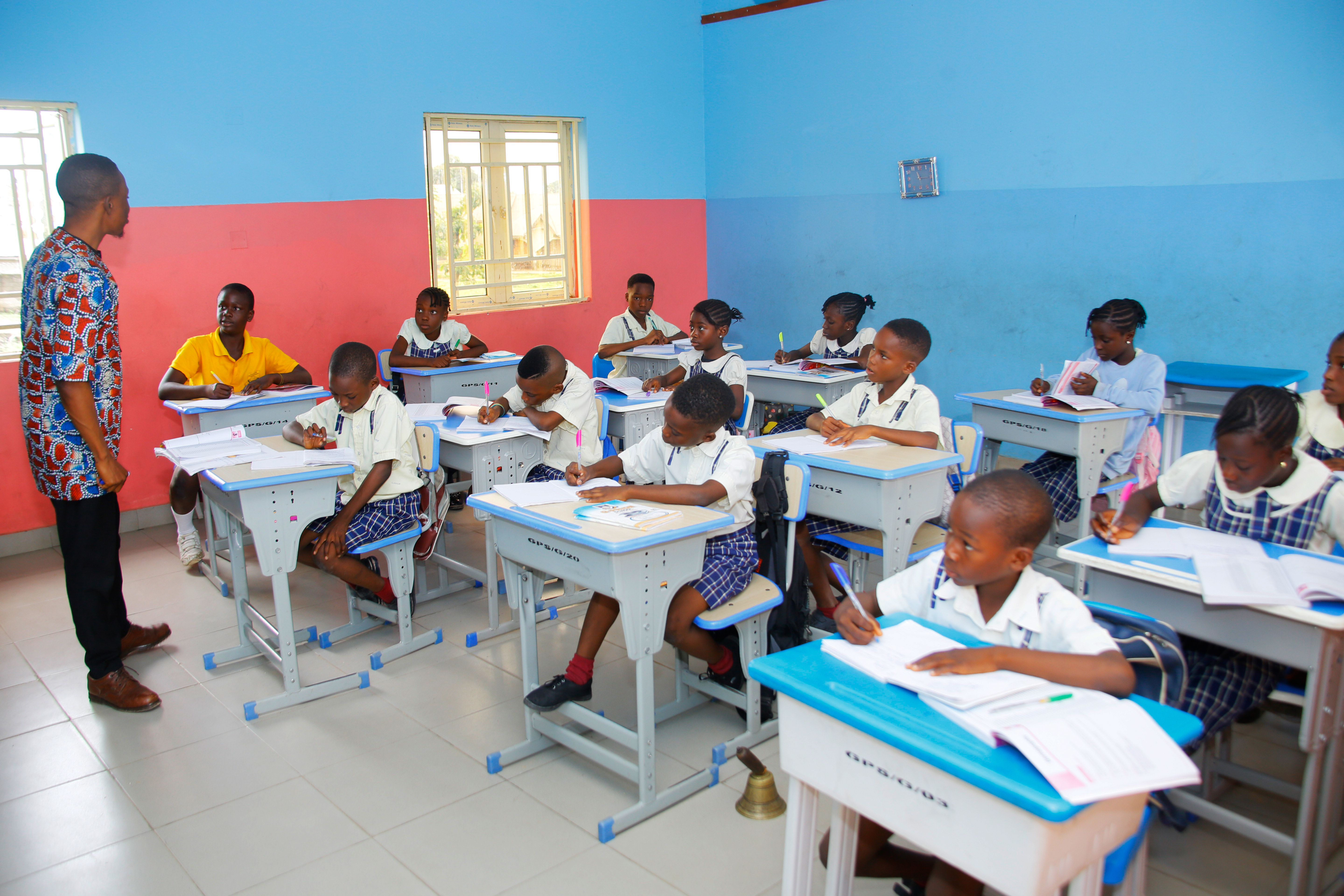 Teacher assisting student